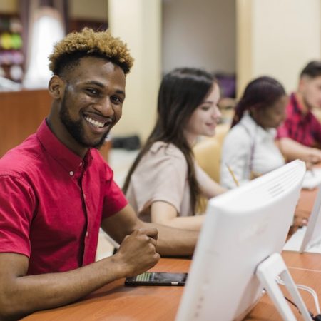 smiling-man-computer-class_23-2147663661